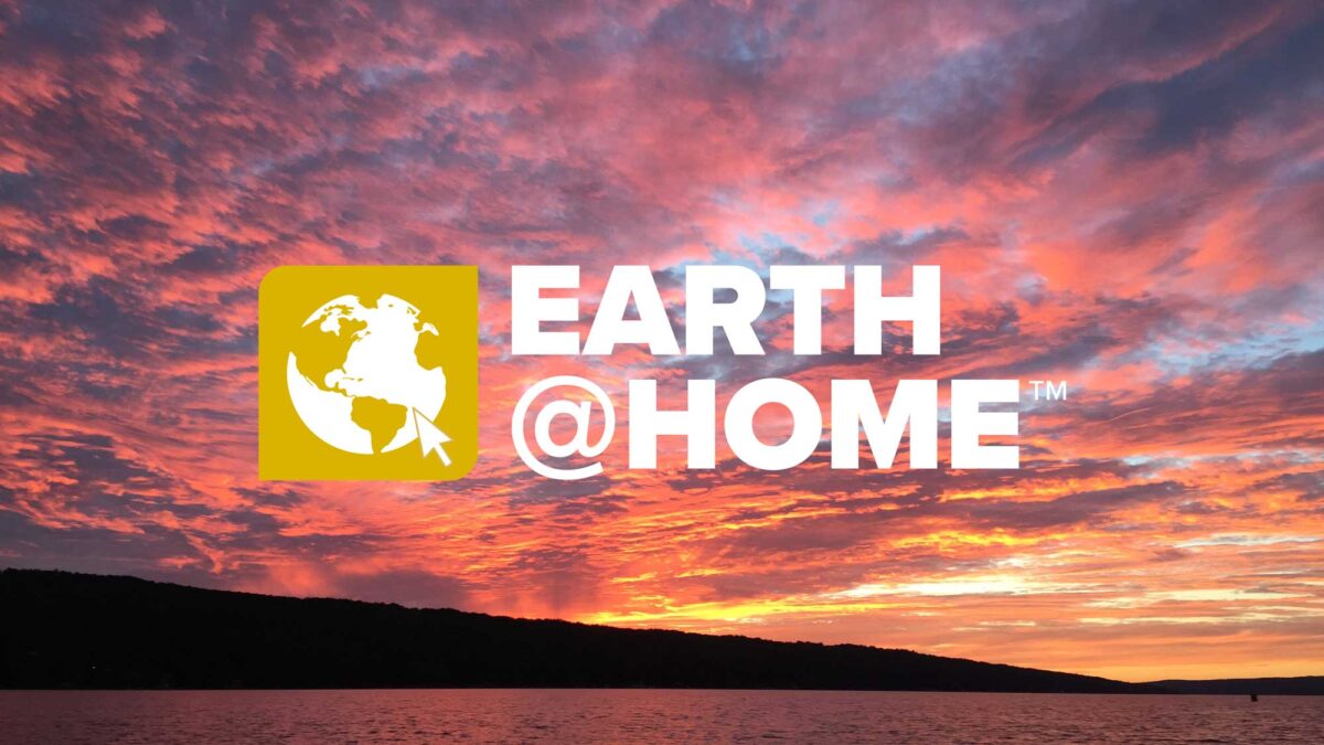 Earth@Home logo on a photograph of a sunset over a lake.