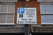 A sign warning of a controlled parking zone in operation