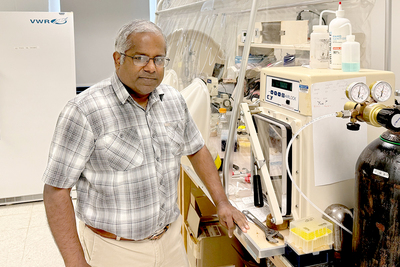 Portrait of Satish Nair in his laboratory