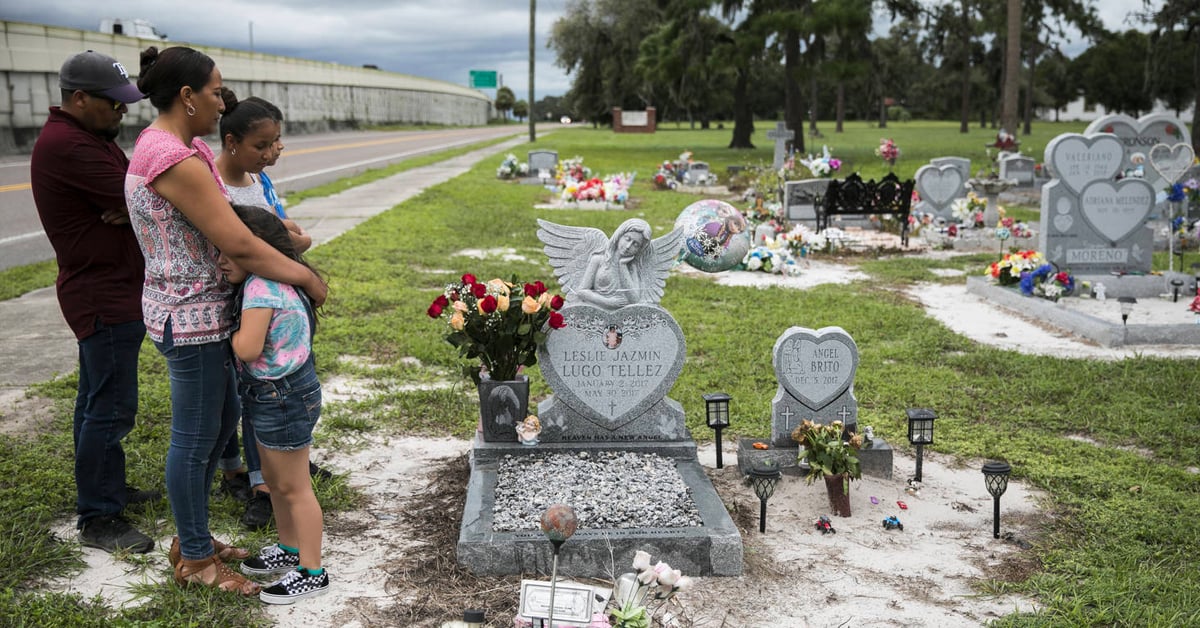 The family mourns the loss of Leslie Lugo at the cemetary.