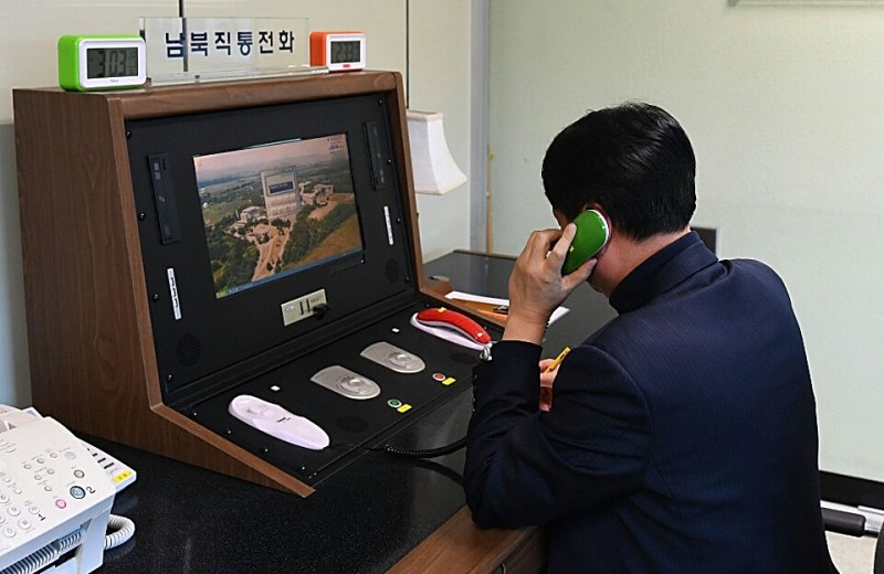 A South Korean government official checks the direct communications hotline to talk with the North Korean side at the border village of Panmunjom on Jan. 3, in Panmunjom, South Korea. (South Korean Unification Ministry via Getty Images)