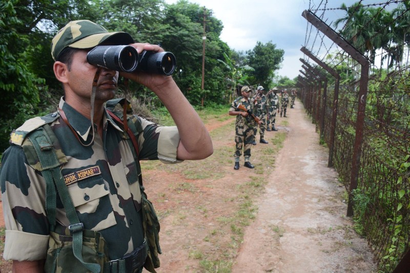 A Border Security Force (BSF) personnel patrols near the India Bangladesh fencing border ahead of 72nd Independence Day celebrations, at Lankamura village in Agartala, the capital of northeastern state of Tripura on August 13, 2018. (ARINDAM DEY/AFP/Getty Images)
