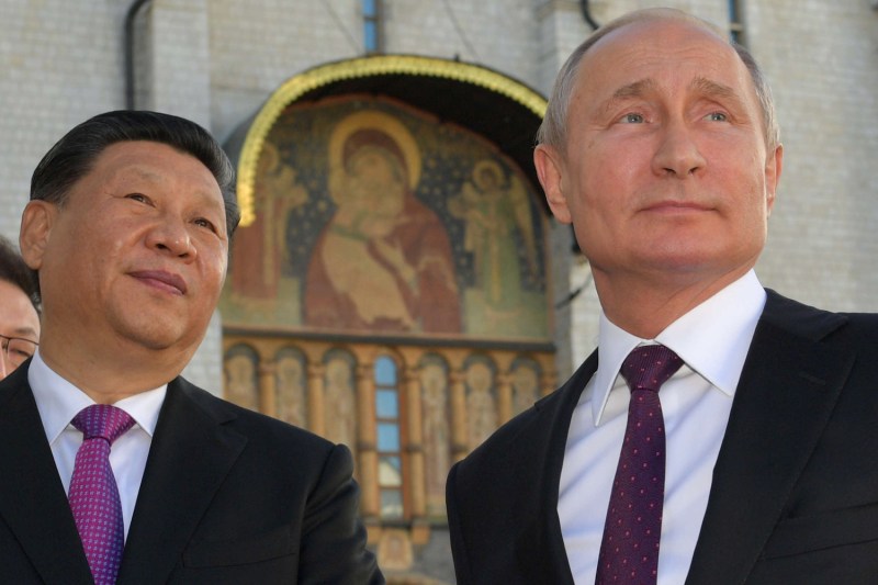 Russian President Vladimir Putin and his Chinese counterpart, Xi Jinping, tour the Kremlin in Moscow on June 5.