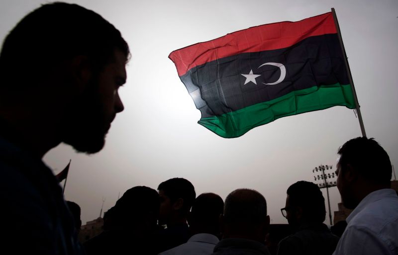 Libyans gather during the funeral of fighters loyal to the Government of National Accord in the capital of Tripoli on April 24.