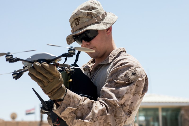 A U.S. Marine prepares to launch an InstantEye quadcopter system on Aug. 12, 2018.