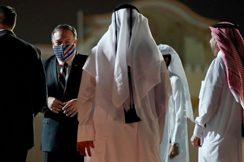 Secretary of State Mike Pompeo prepares to board his plane at the Old Doha International airport in the Qatari capital Doha, on Nov. 21, 2020.