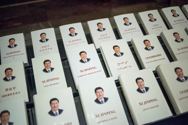 Chinese President Xi Jinping’s book, translated into foreign languages, is on display during the opening ceremony of a high-level meeting held by the Chinese Communist Party at the Great Hall of the People in Beijing, on Dec. 1, 2017.