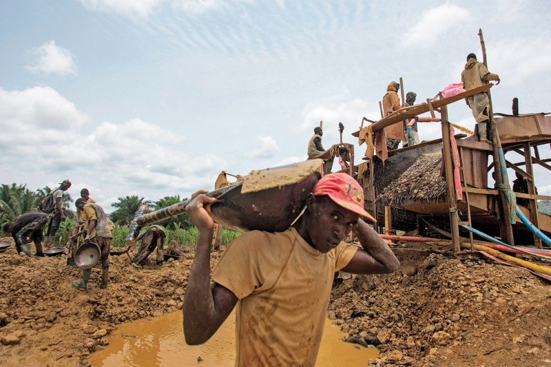 A group of illegal gold panners look for gold in the Kibi area of southern Ghana