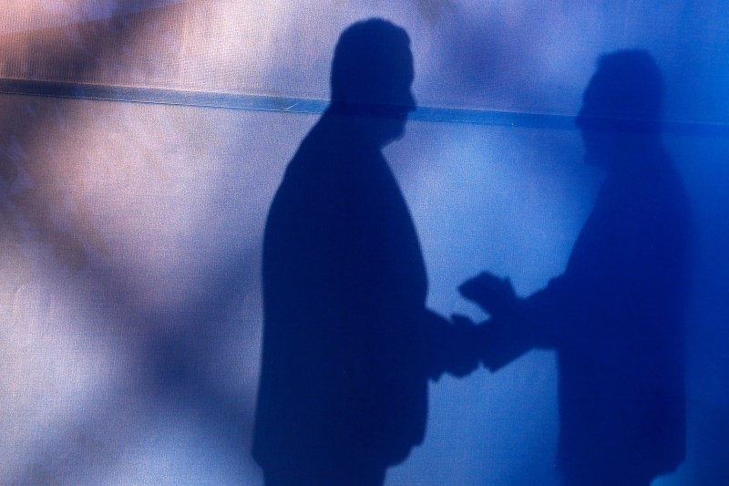 A silhouette of diplomats meeting in Belgrade on Dec. 3, 2015.