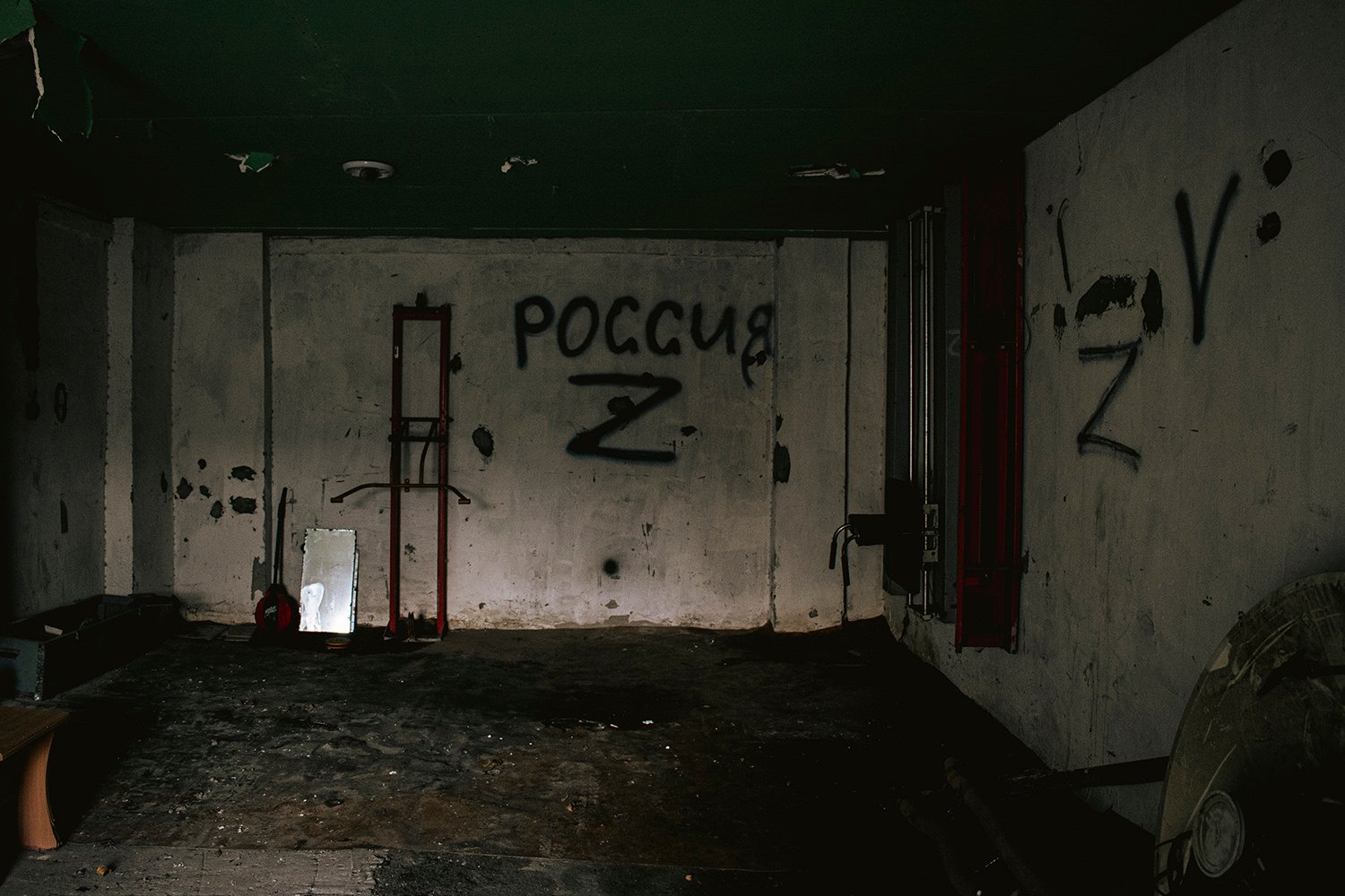 “Russia” and “Z” are scrawled on the walls of an alleged torture room in Ukraine.