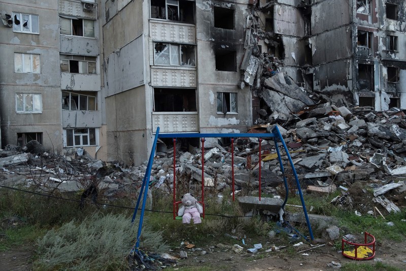 A stuffed toy sits in the remains of a playground in the heavily damaged Saltivka suburb of Kharkiv, Ukraine.