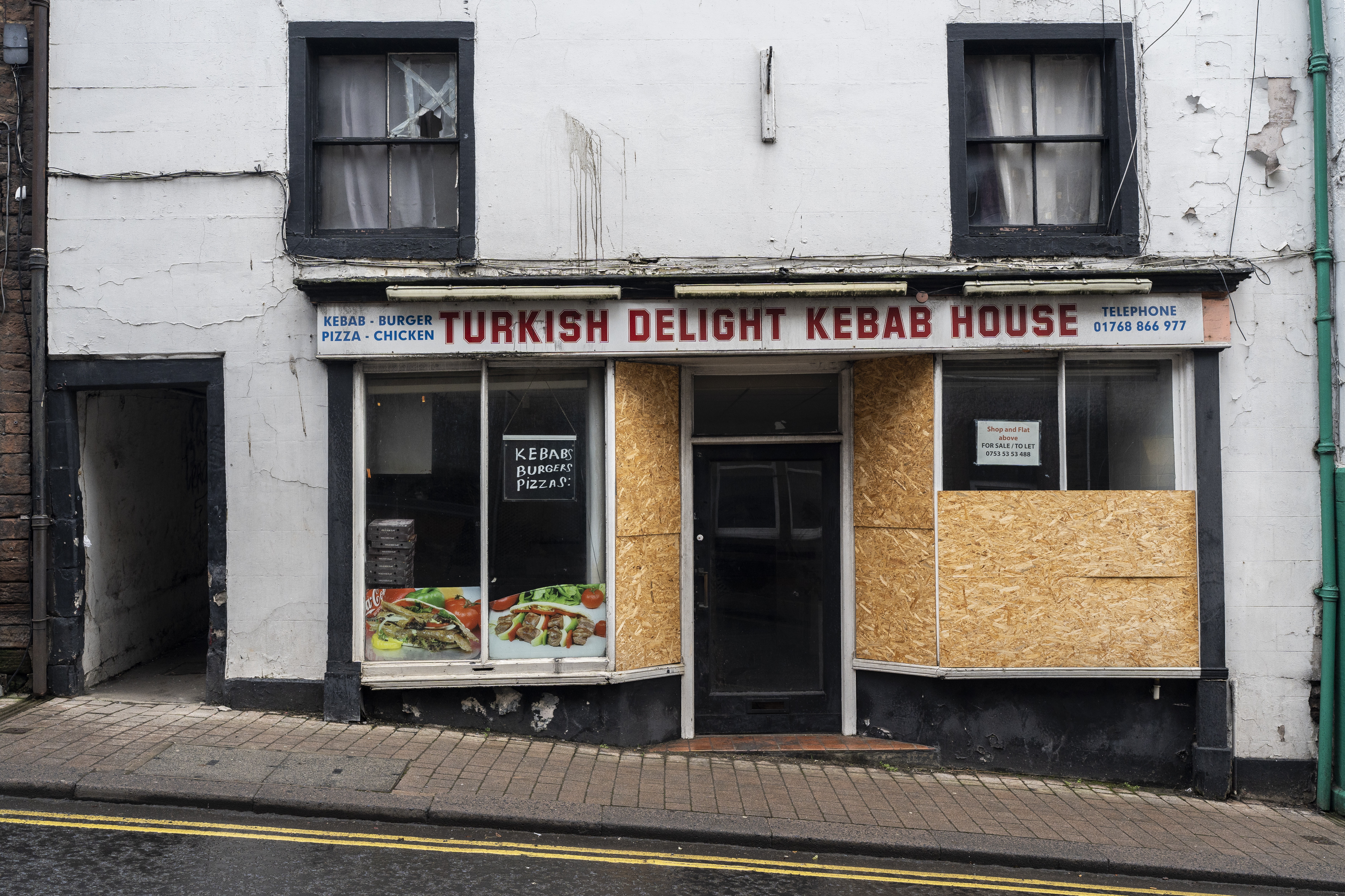 A Turkish kebab shop is shuttered ahead of its sale in Penrith, Britain.