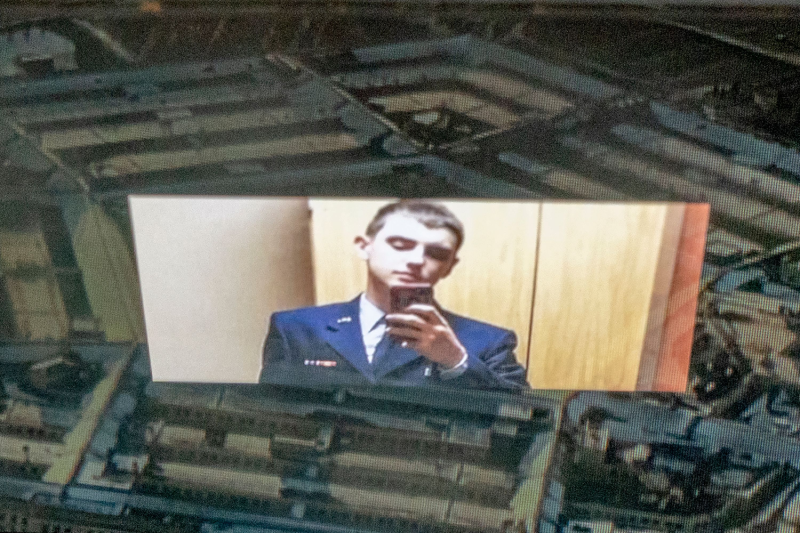 This photo illustration created on April 13 shows the suspect in recent U.S. military intelligence leaks, National Guard member Jack Teixeira, shown in uniform while taking a selfie that is reflected in an image of the Pentagon in Washington, D.C.