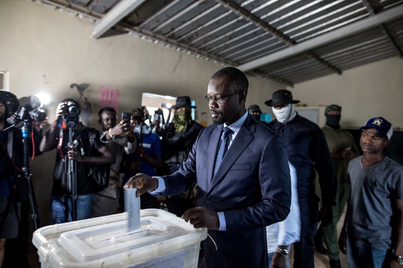 Ousmane Sonko casts his ballot at a school.