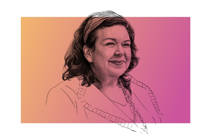 An illustration shows British Ambassador to the United States Karen Pierce. Pierce is drawn in a photorealistic style from her head to her neck, whereas the lines of her shirt and jacket are merely outlined and unshaded. The illustration is on top of a gradient of orange to pink.