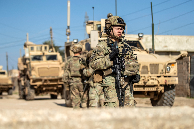 U.S. soldiers patrol an area in the town of Tell Hamis, in Syria's northeastern Hasakah governorate.