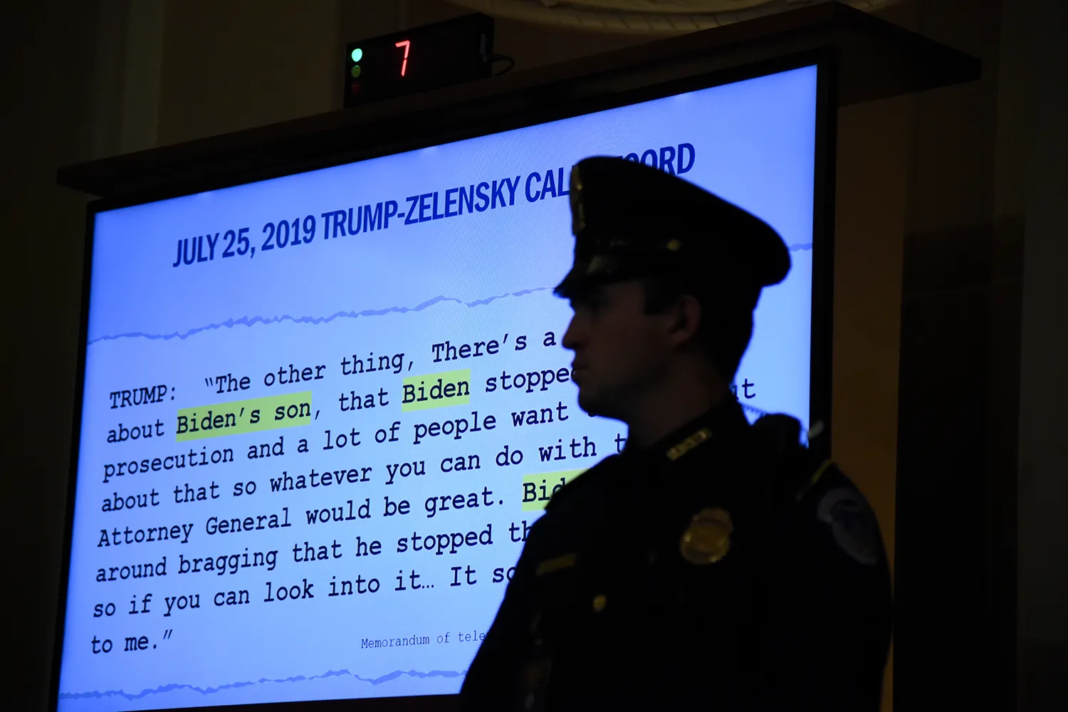 A screen with a transcript of a Trump-Zelensky call is displayed in Trump's impeachment trial.