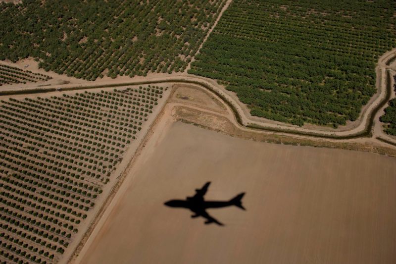 Air Force One’s shadow is seen on farmland after taking off with then-U.S. President Barack Obama and the first family on board, seen in Merced County, California, on June 19, 2016.