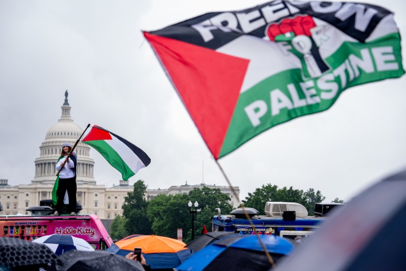 A protester waves a Palestinian flag during a pro-Palestinian “Nakba 76” rally in Washington, D.C.