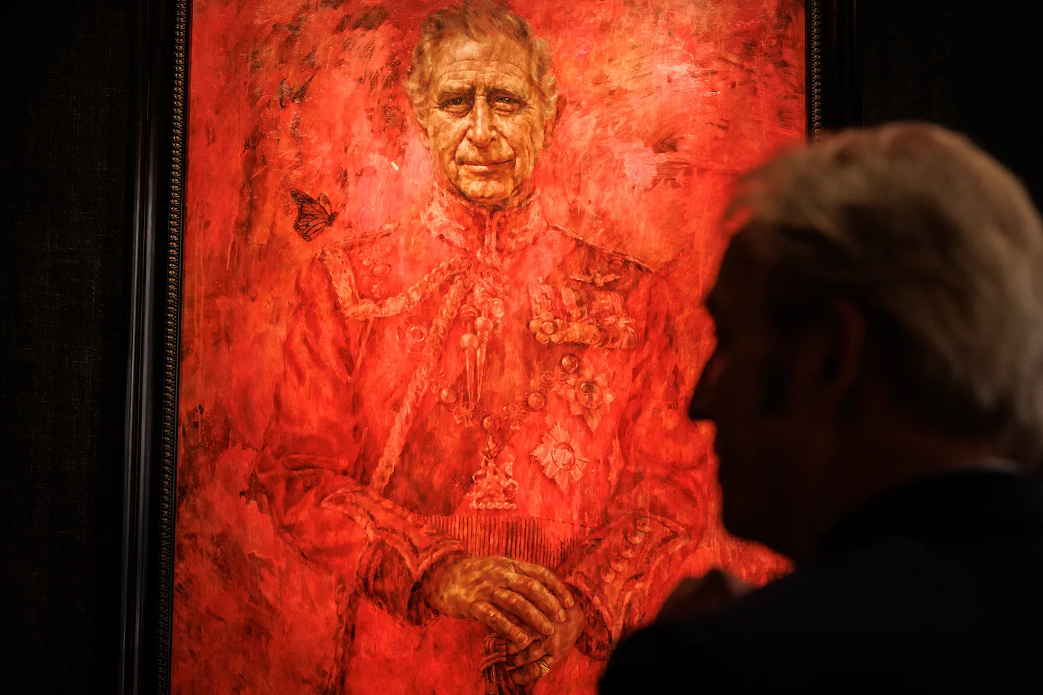 Members of the public view a newly installed painting of the United Kingdom’s King Charles III at the Philip Mould Gallery in London on May 16.