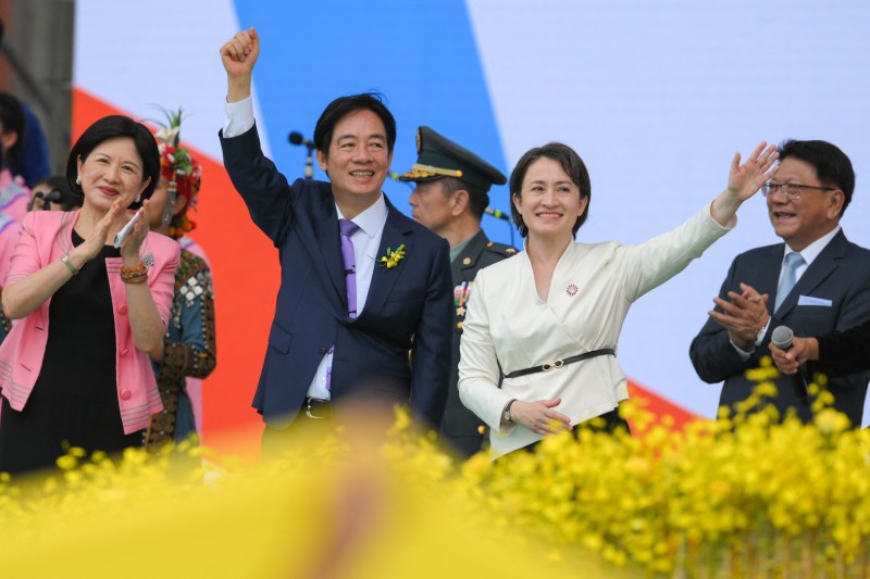 Taiwanese President Lai Ching-te and first lady Wu Mei-ju gesture after his inaugural speech at the Presidential Office Building in Taipei.