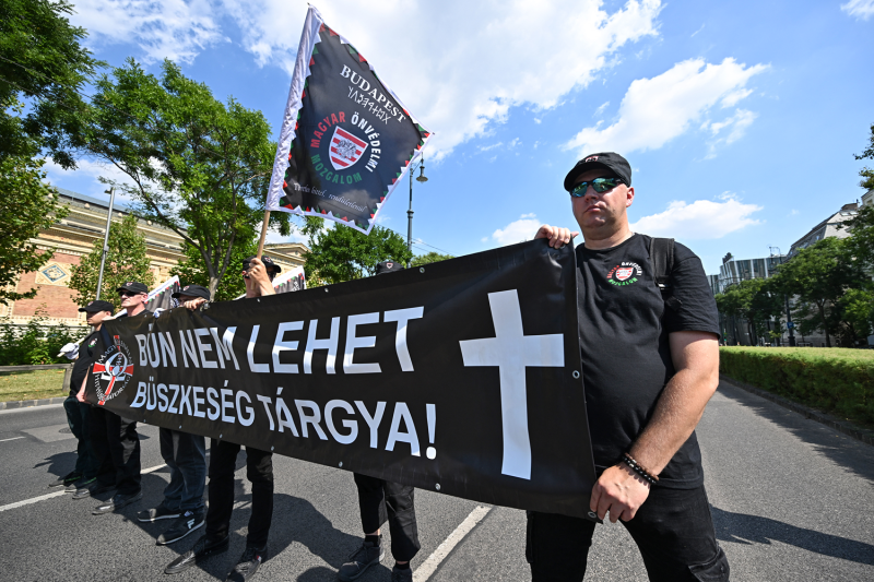 Members of the far-right “Hungarian Self-Defense Movement” hold a banner reading “Sin should not be an object of pride” at the protest against the Pride parade in Budapest, Hungary.