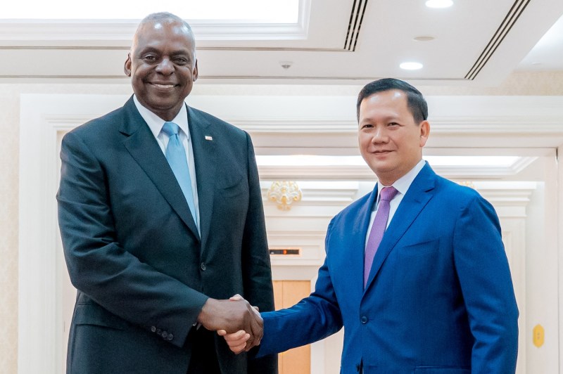 U.S. Defense Secretary Lloyd Austin shakes hands with Cambodian Prime Minister Hun Manet during a meeting at the Peace Palace in Phnom Penh, Cambodia, on June 4.