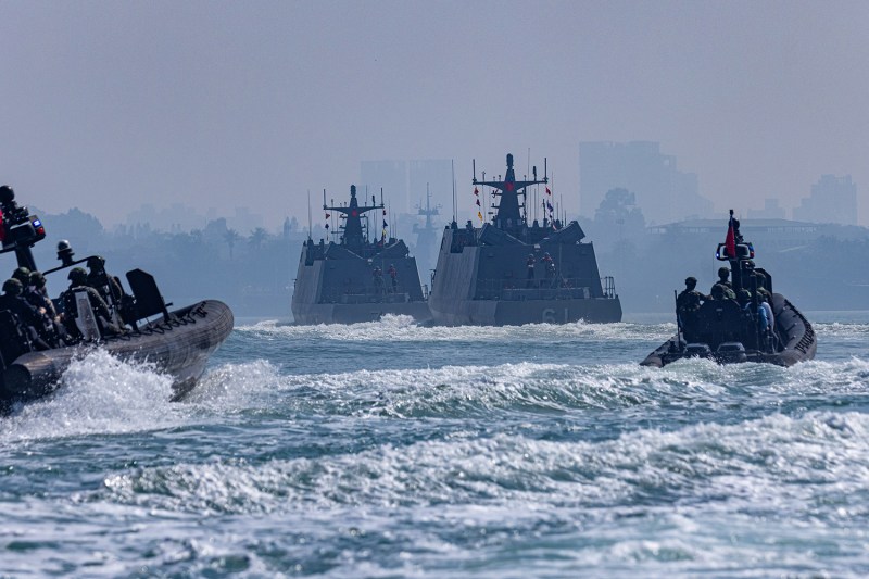 Taiwanese missile boats and smaller craft maneuver on the sea during a military drill in Kaohsiung, Taiwan.