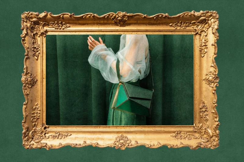 A photo illustration shows a fine art from with a woman in a green cocktail dress.