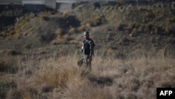 A Pakistani soldier stands guard near the border with Afghanistan. (file photo)