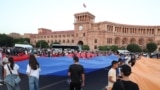 Young people celebrate Armenia's Constitution Day outside the main government building in Yerevan on July 5.