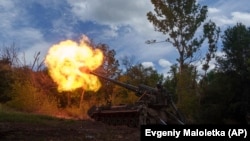 Ukrainian soldiers fire a 2s7 self-propelled howitzer at Russian positions along the front line in the eastern Donetsk region earlier this week.