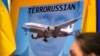  Зображення очільника Росії Володимира Путіна на плакаті учасників акції