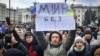 UKRAINE – A man holds a banner that reads: "World without Russia", during a rally against the Russian occupation in Svobody (Freedom) Square in Kherson, Ukraine, March 5, 2022