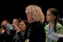 Сверхновая звезда экологического активизма Грета Тунберг и исполнительный директор Greenpeace International Дженнифер Морган на конференции в Мадриде