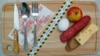 GENERIC – Food is lying on the kitchen board next to Russian money and a protective tape with the inscription "price growth"