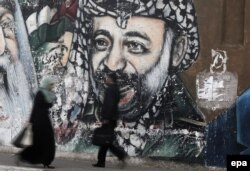 Изображение Ясира Арафата на улице в секторе Газа. 2016 год