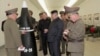 资料照片：2023年3月28日，视频截图显示朝鲜领导人金正恩在一个没有披露的地点视察核弹头。（路透社照片）