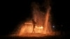 A fire dancer performs during a show for tourists on Batu Ferringhi Beach on Penang Island, Malaysia, July 11, 2024. 