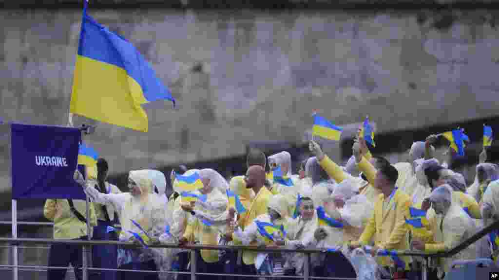 The boat carrying Team Ukraine makes its way down the Seine in Paris, during the opening ceremony of the 2024 Summer Olympics, July 26, 2024.