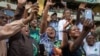 Supporters cheer former South African President Jacob Zuma as he arrives at Orlando stadium in the township of Soweto, Johannesburg, South Africa, for the launch of his newly formed uMkhonto weSizwe (MK) party's manifesto, May 18, 2024. 