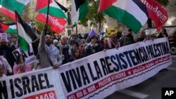 FILE - People march during a pro-Palestinian rally in Madrid on Dec. 2, 2023. 