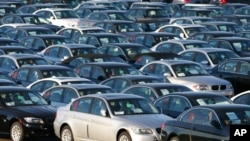 FILE - Imported German-made BMWs are parked at the North East Auto Terminal, Oct. 23, 2008, in Jersey City, N.J. BMW and two other automakers have used parts from a Chinese supplier banned in the U.S. for forced labor, congressional investigators said.