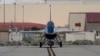 An AI-enabled U.S. Air Force F-16 fighter jet, the X-62A VISTA, taxies after an experimental flight, May 2, 2024, at Edwards Air Force Base, California. U.S. and Chinese officials plan to meet in Switzerland on May 24 to discuss artificial intelligence security concerns.