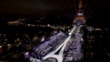 This photo released by the Olympic Broadcasting Services shows the Trocadero and the Eiffel Tower lit up with the Olympic rings during the opening ceremony of the 2024 Summer Olympics in Paris, July 26, 2024.