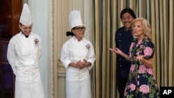 FILE - First lady Jill Biden walks past White House Executive Pastry Chef Susie Morrison, White House Executive Chef Cris Comerford, and guest Chef Edward Lee, in advance of a State Dinner with South Korea's President Yoon Suk Yeol, Apr. 24, 2024.