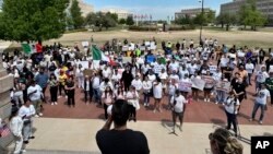 Demonstrators at the Oklahoma Capitol on April 23, 2024, protest a measure that imposes criminal penalties for being in the state illegally. The U.S. Justice Department on May 22, 2024, sued to block the law.