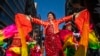 FILE - Revelers take part during the Chinese New Year 'The Dragon' parade in the Chinatown neighborhood of Manhattan, New York, Feb. 25, 2024.