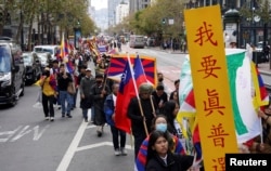 People protest against Chinese President Xi Jinping during the Asia-Pacific Economic Cooperation summit in San Francisco, Nov. 15, 2023.