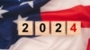 United States election. Wooden cubes with letters 2024 over the American flag background